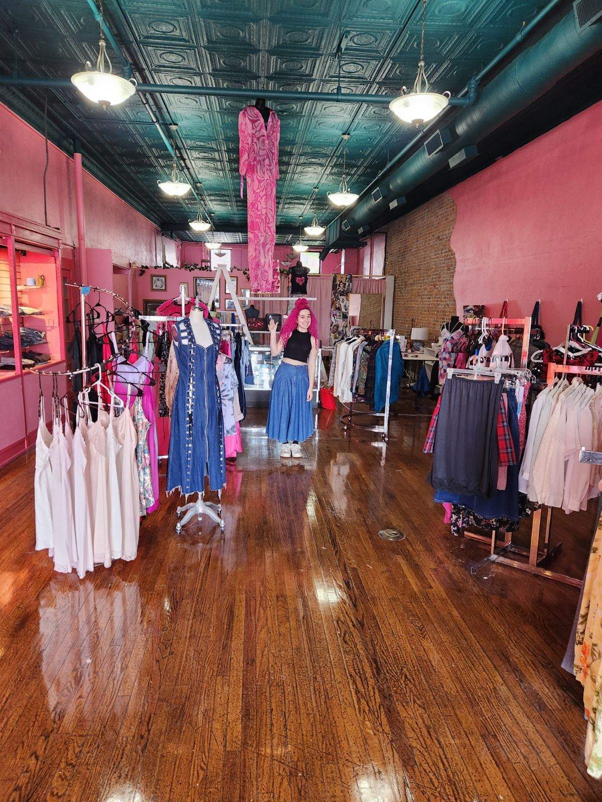 The full retail floor under the pressed-tin ceiling